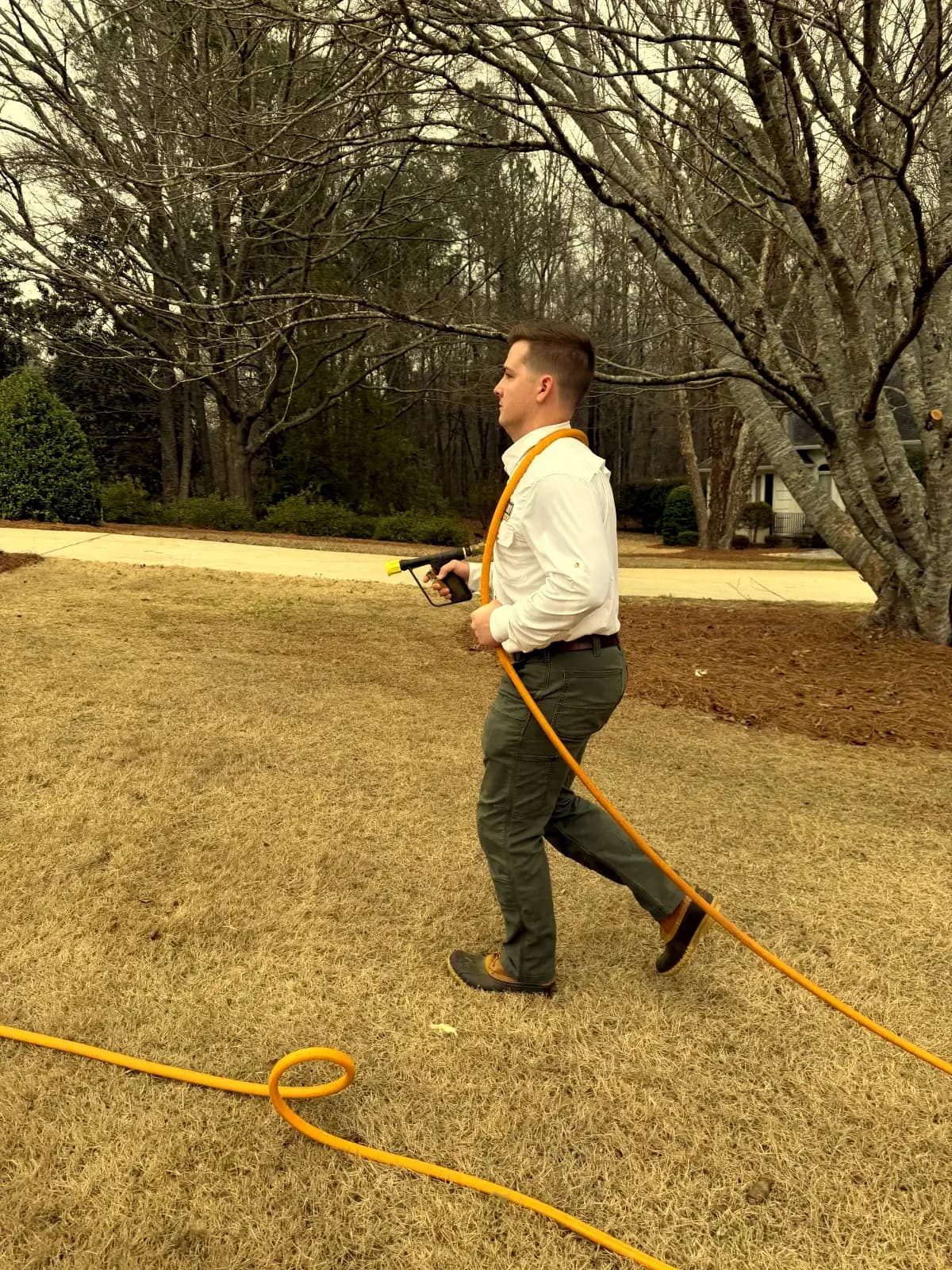 Professional spray wand treatment for lawn grub control