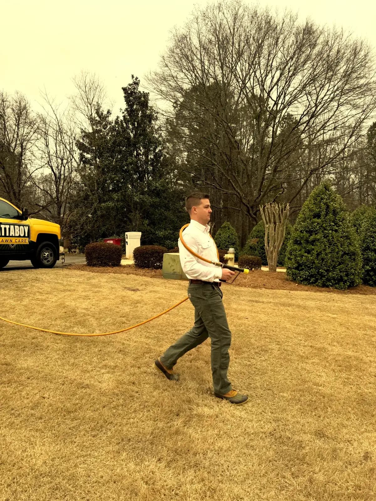 Professional pre-emergent herbicide application on a residential lawn