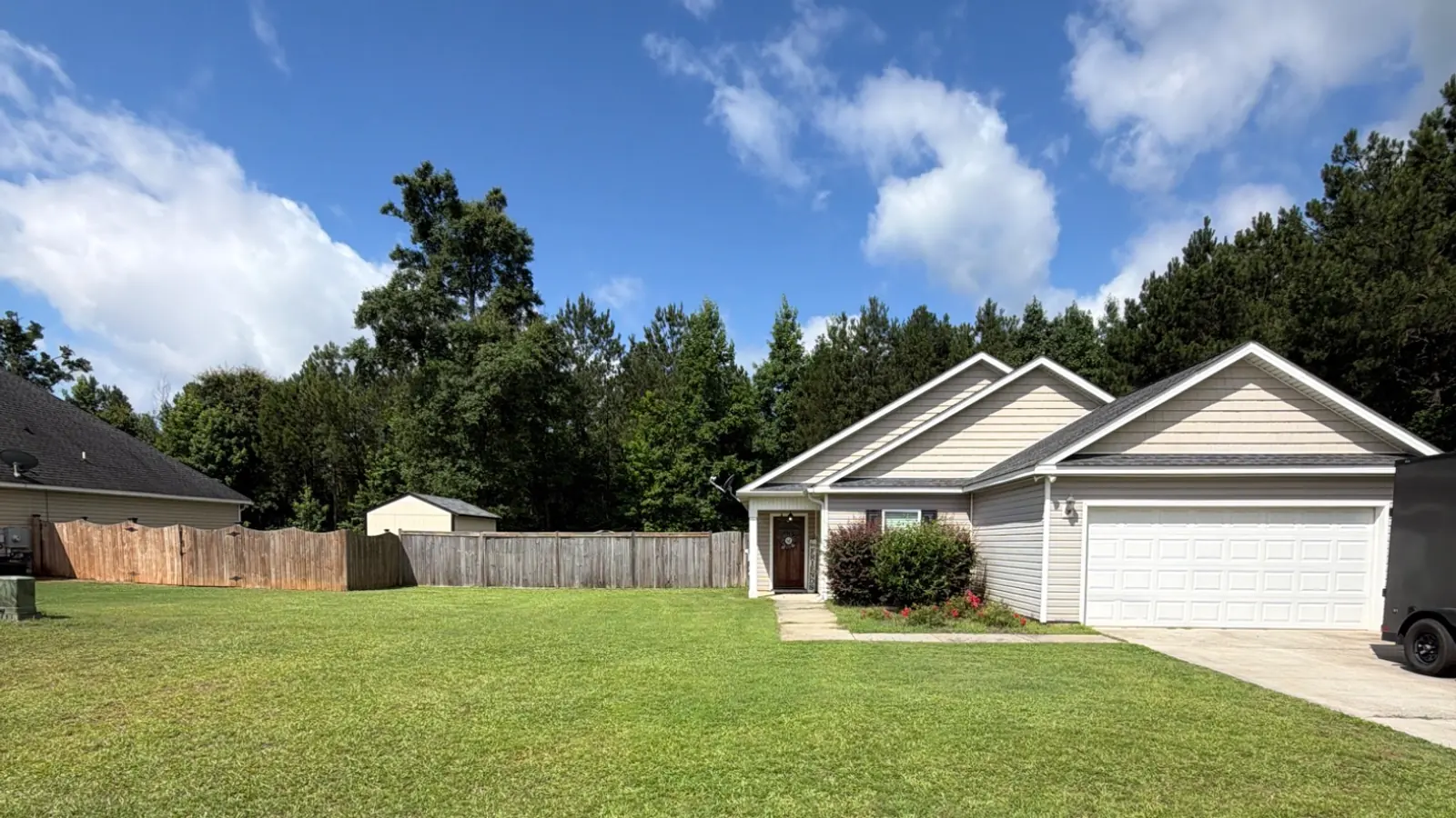 Thick green lawn in front of an Attaboy Lawn Care customer's home in Middle Georgia
