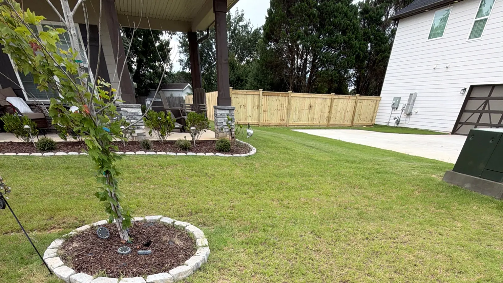 Thick green lawn in front of an Attaboy Lawn Care customer's home in Middle Georgia