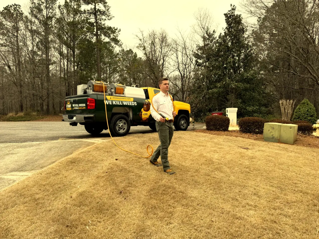 Professional weed control treatment by Attaboy Lawn Care in Central Georgia